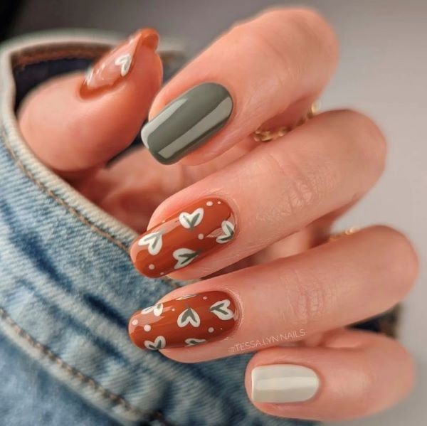 Burnt Orange Nails with Green Leaf Designs 