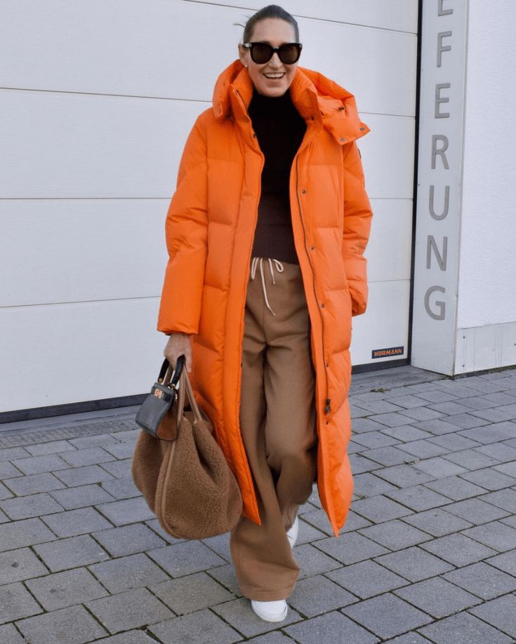 Bright orange puffer coat- winter outfits 2023