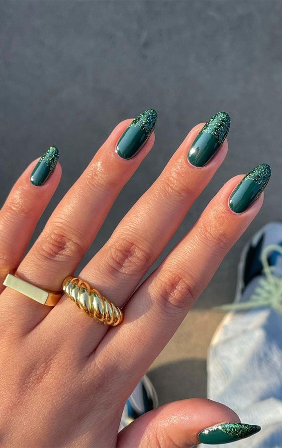 dark green nails with glitter french tip